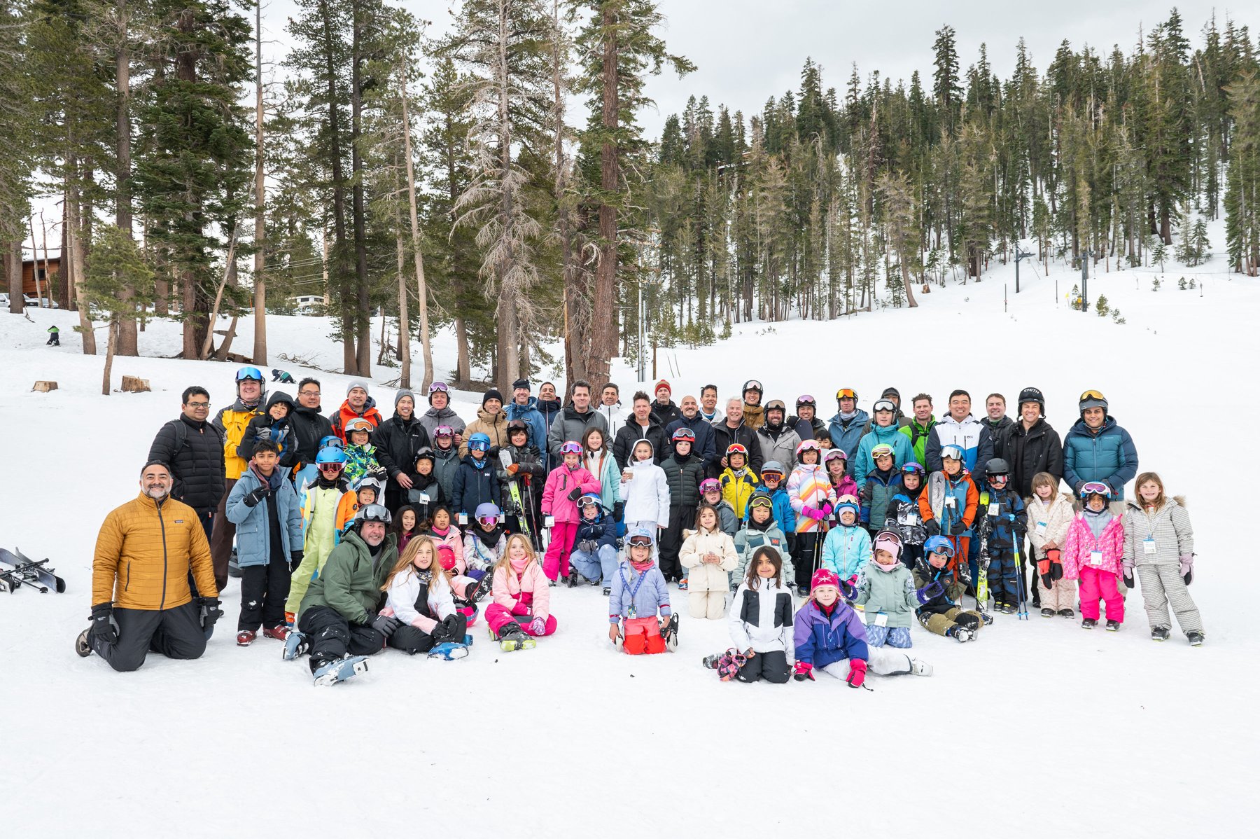Dads and children gather in ski gear during the 2025 Mammoth trip
