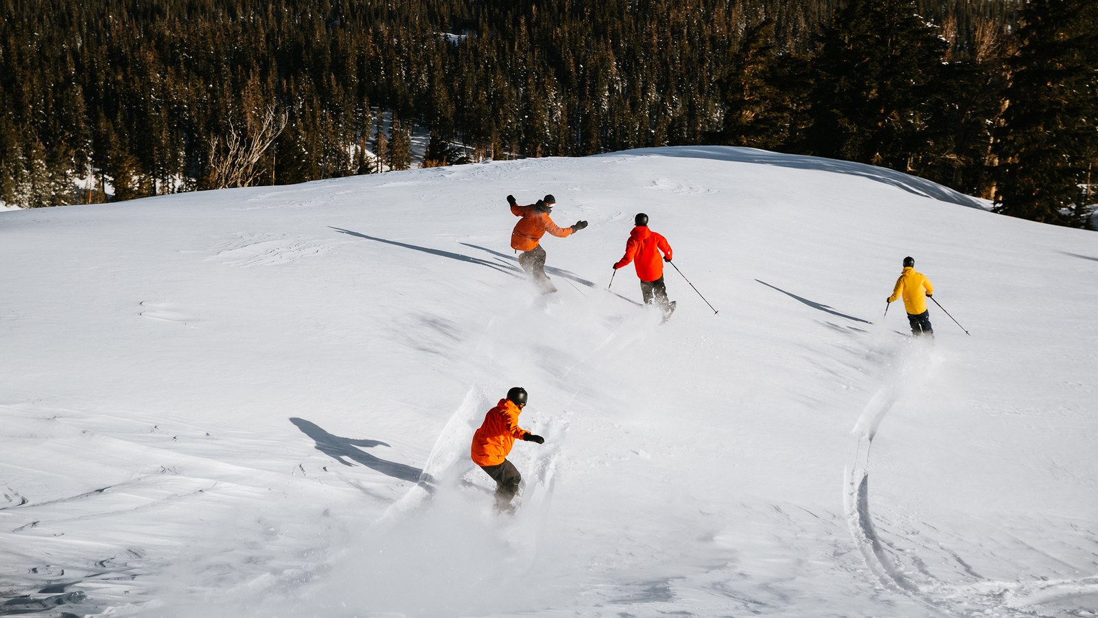 Skiers on a snowy slope at Mammoth Mountain